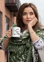 mockup-of-a-middle-aged-woman-holding-an-11-oz-coffee-mug-outside-31600.webp